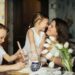 A joyful moment of a mother baking with her children in a cozy home environment.